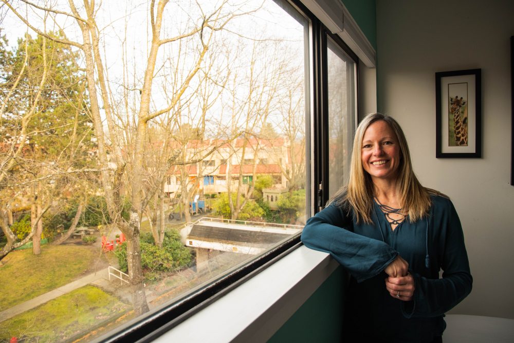 False Creek South resident Christie in a bedroom in her home