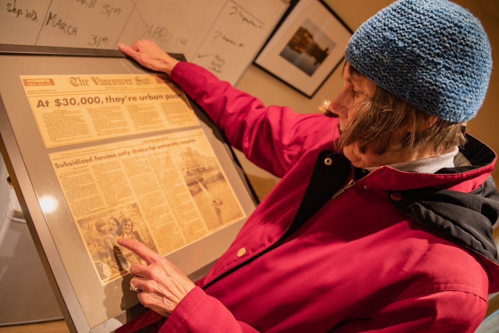 Nancy with a 1960's newspaper article which portrays the co-op in a negative light